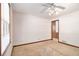 This bedroom has a ceiling fan, a window, and a wooden door at 338 Patterson Rd, Lawrenceville, GA 30044