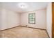 This bedroom has a window and light fixture at 338 Patterson Rd, Lawrenceville, GA 30044