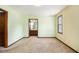 This bedroom has an ensuite bathroom, a window, and trim throughout at 338 Patterson Rd, Lawrenceville, GA 30044