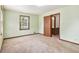 This bedroom has an ensuite bathroom, a window, and trim throughout at 338 Patterson Rd, Lawrenceville, GA 30044