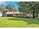 Charming single story home with a covered front porch and lush green lawn, great curb appeal at 338 Patterson Rd, Lawrenceville, GA 30044