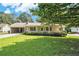 Charming single story home with a covered front porch and lush green lawn on a sunny day at 338 Patterson Rd, Lawrenceville, GA 30044