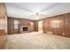 Living room showcasing wood paneling and a brick fireplace at 338 Patterson Rd, Lawrenceville, GA 30044