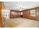 Living room featuring wood paneling and ceiling fan at 338 Patterson Rd, Lawrenceville, GA 30044