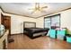 Spacious bedroom with hardwood floors, ceiling fan, and natural light at 1198 Old Mill Rd, Dallas, GA 30157