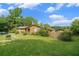 A cozy house with a large yard and a small storage building in the back at 1198 Old Mill Rd, Dallas, GA 30157