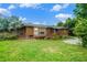 Charming log cabin with a green lawn and mature trees at 1198 Old Mill Rd, Dallas, GA 30157