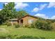 Charming cottage-style home with green shutters and natural wood siding nestled on a grassy lot at 1198 Old Mill Rd, Dallas, GA 30157