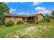 Inviting home featuring a lovely porch and stone accents, set on a neatly kept lawn at 1198 Old Mill Rd, Dallas, GA 30157