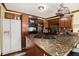 A kitchen showcasing a tile counter top and wooden cabinets at 1198 Old Mill Rd, Dallas, GA 30157
