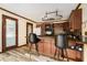 Well-appointed kitchen featuring counter seating, dark wood cabinets, and modern appliances at 1198 Old Mill Rd, Dallas, GA 30157