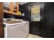 A laundry room featuring a washer, dryer, and door to the outside at 1198 Old Mill Rd, Dallas, GA 30157