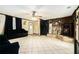 Large living area boasting tile flooring, a fireplace, and a dark sofa at 1198 Old Mill Rd, Dallas, GA 30157