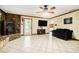 Spacious living room featuring tile flooring, a stone fireplace, and ample natural light at 1198 Old Mill Rd, Dallas, GA 30157