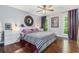 Bedroom with hardwood floors, ceiling fan, modern decor, and natural light at 5149 Roswell Rd # 1, Atlanta, GA 30342