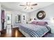 Modern bedroom with hardwood floors, contemporary decor, and ensuite bathroom access at 5149 Roswell Rd # 1, Atlanta, GA 30342