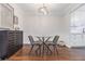 Dining area featuring a glass table, modern decor, and hardwood floors at 5149 Roswell Rd # 1, Atlanta, GA 30342