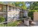 Townhouse exterior featuring neutral siding and well-maintained landscaping at 5149 Roswell Rd # 1, Atlanta, GA 30342