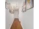 Hallway featuring hardwood floors and gallery walls. A bright and airy space at 5149 Roswell Rd # 1, Atlanta, GA 30342
