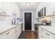 Modern kitchen featuring white cabinetry, stainless steel appliances, and stylish subway tile backsplash at 5149 Roswell Rd # 1, Atlanta, GA 30342