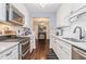 Modern kitchen with white cabinets, subway tile, stainless steel appliances and hardwood floors at 5149 Roswell Rd # 1, Atlanta, GA 30342