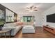 Bright living room featuring large sectional sofa, hardwood floors, and abundant natural light at 5149 Roswell Rd # 1, Atlanta, GA 30342