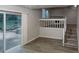 Basement with hardwood floors, sliding glass doors, fireplace, staircase and neutral paint at 733 Emerald Forest Cir, Lawrenceville, GA 30044