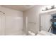 The bright bathroom is complete with a shower, toilet, sink, and modern lighting at 733 Emerald Forest Cir, Lawrenceville, GA 30044