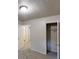 This cozy bedroom has plush carpet, a closet and two doorways to other rooms at 733 Emerald Forest Cir, Lawrenceville, GA 30044