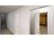 Hallway with one open door to the garage and access to stairs at 733 Emerald Forest Cir, Lawrenceville, GA 30044