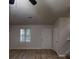 Open-concept living room featuring hardwood floors, a front door, staircase, and neutral paint at 733 Emerald Forest Cir, Lawrenceville, GA 30044