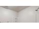A bright bathroom features a shower, a grab bar and built-in shelving at 733 Emerald Forest Cir, Lawrenceville, GA 30044