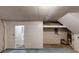 View of the unfinished basement space, including a door to another room at 733 Emerald Forest Cir, Lawrenceville, GA 30044