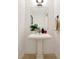Bright half bath featuring a pedestal sink, modern fixtures, and elegant neutral tones at 905 Juniper Ne St # 805, Atlanta, GA 30309