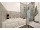 Bright bathroom featuring a soaking tub, separate shower, and wood look floors at 905 Juniper Ne St # 805, Atlanta, GA 30309
