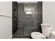 Sleek walk-in shower with gray tile, plus a toilet and towel bar at 905 Juniper Ne St # 805, Atlanta, GA 30309