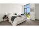 This bedroom features a large window providing plenty of natural light at 905 Juniper Ne St # 805, Atlanta, GA 30309