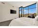 Comfortable bedroom with city views, large windows, and neutral decor at 905 Juniper Ne St # 805, Atlanta, GA 30309