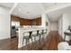 Modern kitchen with stainless steel appliances, bar seating, and sleek hardwood flooring at 905 Juniper Ne St # 805, Atlanta, GA 30309