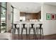 Modern kitchen featuring bar stool seating, stainless steel appliances, and lots of natural light at 905 Juniper Ne St # 805, Atlanta, GA 30309