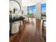 Bright living room with floor-to-ceiling windows and gleaming hardwood floors at 905 Juniper Ne St # 805, Atlanta, GA 30309