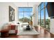 Bright living area with large windows, hardwood floors, and comfortable modern furniture at 905 Juniper Ne St # 805, Atlanta, GA 30309
