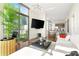 Stylish living room with modern decor, floor-to-ceiling windows, and city views at 905 Juniper Ne St # 805, Atlanta, GA 30309