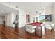 Spacious living room with hardwood floors, natural light, and a stylish pool table at 905 Juniper Ne St # 805, Atlanta, GA 30309