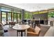 Community lounge area with comfortable seating, tables, and views of the pool at 905 Juniper Ne St # 805, Atlanta, GA 30309