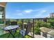 A cozy patio with a table and chairs overlooking the neighborhood at 905 Juniper Ne St # 805, Atlanta, GA 30309