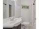 Bathroom features modern fixtures, a white shower/tub and a neutral color scheme at 2049 Rector Dr, Atlanta, GA 30311