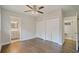Bedroom features hardwood floors, dual closets, and connected bathroom entrances at 2049 Rector Dr, Atlanta, GA 30311