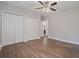 Bedroom features hardwood floors, dual closets, and neutral walls with multiple access doors at 2049 Rector Dr, Atlanta, GA 30311