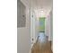 Hallway features hardwood floors, neutral walls, and access to multiple rooms at 2049 Rector Dr, Atlanta, GA 30311